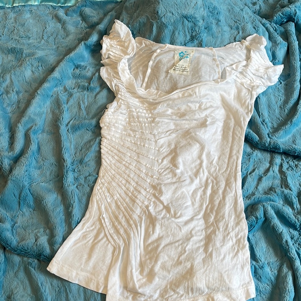 White Anthropologie T with artistic details